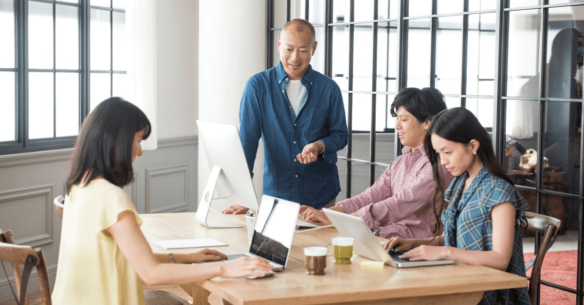 a group of colleagues working together at the office